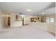 Open living room with mirrored wall and view of kitchen at 4109 66Th Street W Cir # 4109, Bradenton, FL 34209