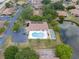 Community pool and shuffleboard area next to a pond at 4109 66Th Street W Cir # 4109, Bradenton, FL 34209