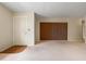 Spacious living room with neutral carpeting and wood doors at 4109 66Th Street W Cir # 4109, Bradenton, FL 34209
