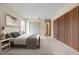Main bedroom with carpeted floor and built-in wooden closet at 4109 66Th Street W Cir # 4109, Bradenton, FL 34209
