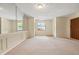 Spacious living room featuring a mirrored wall and carpeted floor at 4109 66Th Street W Cir # 4109, Bradenton, FL 34209