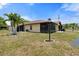 View of the home's exterior, showcasing a landscaped yard at 4109 66Th Street W Cir # 4109, Bradenton, FL 34209
