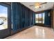 Screened porch with tiled floor and curtains at 4109 66Th Street W Cir # 4109, Bradenton, FL 34209