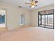 Primary bedroom with patio access and mirrored closet doors at 4109 66Th Street W Cir # 4109, Bradenton, FL 34209