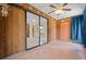 Enclosed patio with tiled floor, sliding glass doors, and ceiling fan at 4109 66Th Street W Cir # 4109, Bradenton, FL 34209