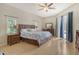 Spacious main bedroom with king-size bed, wood flooring, and access to backyard at 815 128Th Ne St, Bradenton, FL 34212