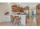 Modern kitchen with stainless steel appliances, granite countertops, and custom cabinetry at 815 128Th Ne St, Bradenton, FL 34212
