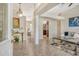Bright and spacious entryway with tile flooring, leading to the living room and kitchen at 815 128Th Ne St, Bradenton, FL 34212