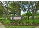 Landscaped entrance sign for Hidden Oaks, a deed-restricted community at 815 128Th Ne St, Bradenton, FL 34212