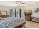 Serene main bedroom with king-size bed and stunning sunset view from the TV at 815 128Th Ne St, Bradenton, FL 34212