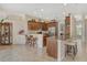 Kitchen with wooden cabinetry, granite countertops, and breakfast bar at 815 128Th Ne St, Bradenton, FL 34212