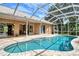 Enclosed pool with view into home's interior at 815 128Th Ne St, Bradenton, FL 34212