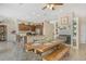 Dining room adjacent to kitchen with a fireplace and wooden table at 815 128Th Ne St, Bradenton, FL 34212