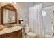 Charming bathroom with floral decor, a vanity, and a shower/tub combo at 815 128Th Ne St, Bradenton, FL 34212