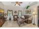 Relaxing living room featuring leather furniture, large TV, and ample natural light at 815 128Th Ne St, Bradenton, FL 34212