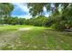 Park-like setting with grassy area and picnic table at 815 128Th Ne St, Bradenton, FL 34212
