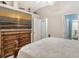 Bright bedroom with large TV and dresser, offering a relaxing atmosphere at 815 128Th Ne St, Bradenton, FL 34212