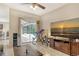 Gathering room with pool view, large TV, and comfortable leather furniture at 815 128Th Ne St, Bradenton, FL 34212