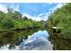 Serene canal view with lush greenery and private docks at 815 128Th Ne St, Bradenton, FL 34212