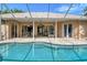 Enclosed pool with view into home's interior at 815 128Th Ne St, Bradenton, FL 34212