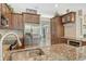 Gourmet kitchen with stainless steel appliances, granite counters, and breakfast bar at 815 128Th Ne St, Bradenton, FL 34212