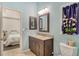 Clean bathroom with dark vanity, granite countertop, and view of bedroom at 815 128Th Ne St, Bradenton, FL 34212