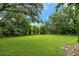 Private backyard with lush lawn and trees at 815 128Th Ne St, Bradenton, FL 34212