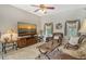 Gathering room with a large TV, comfortable seating, and access to the pool at 815 128Th Ne St, Bradenton, FL 34212