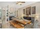 Spacious dining area with a wooden farmhouse table and fireplace at 815 128Th Ne St, Bradenton, FL 34212