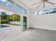 Bright living room with sliding glass doors leading to the pool area at 2234 Hibiscus St, Sarasota, FL 34239