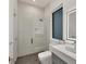 Modern bathroom with a walk-in shower and floating vanity at 2234 Hibiscus St, Sarasota, FL 34239