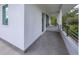 Modern balcony with gray tile flooring and metal railings at 2234 Hibiscus St, Sarasota, FL 34239