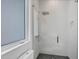 Modern shower with glass enclosure and gray tile floor at 2234 Hibiscus St, Sarasota, FL 34239