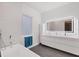 Contemporary bathroom with dual sinks, a large mirror, and a wave patterned wall at 2234 Hibiscus St, Sarasota, FL 34239