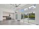 Bright living room with sliding glass doors opening to a pool and patio at 2234 Hibiscus St, Sarasota, FL 34239