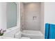 Clean bathroom with a bathtub, window, and modern fixtures at 2234 Hibiscus St, Sarasota, FL 34239