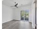 Spacious bedroom with a ceiling fan and private balcony access at 2234 Hibiscus St, Sarasota, FL 34239