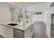 Modern kitchen with island, stainless steel appliances, and white cabinets at 2234 Hibiscus St, Sarasota, FL 34239