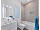 Modern bathroom with a bathtub, illuminated mirror, and gray tile at 2234 Hibiscus St, Sarasota, FL 34239