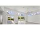Spacious living area with multiple sliding glass doors and a ceiling fan at 2234 Hibiscus St, Sarasota, FL 34239