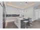 Modern kitchen with white cabinets, island, and stainless steel appliances at 2234 Hibiscus St, Sarasota, FL 34239