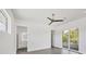 Bright bedroom with ceiling fan, private bathroom, and balcony access at 2234 Hibiscus St, Sarasota, FL 34239