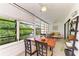 Sunroom dining area with water views and wood table at 184 Pineneedle Dr # 184, Bradenton, FL 34210