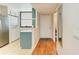 Bright entryway with wood floors and a view into the kitchen at 184 Pineneedle Dr # 184, Bradenton, FL 34210