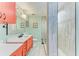 Updated bathroom with coral vanity, a large shower, and modern fixtures at 184 Pineneedle Dr # 184, Bradenton, FL 34210