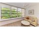 Bright sunroom with water views and seating area at 184 Pineneedle Dr # 184, Bradenton, FL 34210
