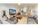 Open living room with hardwood floors and kitchen views at 184 Pineneedle Dr # 184, Bradenton, FL 34210