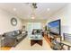 Spacious living room featuring leather sofas and a large flat-screen TV at 184 Pineneedle Dr # 184, Bradenton, FL 34210