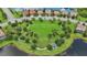 Aerial view of a well-maintained park in the community with a pond, gazebo, and playground at 13215 Ramblewood Trl, Bradenton, FL 34211