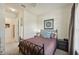 Bedroom featuring a comfortable bed, side tables, and ample closet space for organized living at 13215 Ramblewood Trl, Bradenton, FL 34211